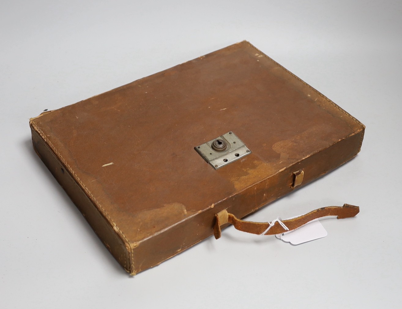 A leather cased Bakelite mahjong set